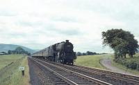 Kingmoor Black 5 45105 approaching Symington from the south on 10 July 1965. The train is a summer Saturday relief from Morecambe to Glasgow Central.<br><br>[John Robin 10/07/1965]