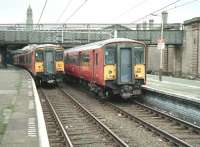 318267 with a Gourock train standing alongside 318268 heading for Glasgow Central. Scene at the east end of Greenock Central station in 1990.<br><br>[Bill Roberton //1990]