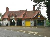 The former station at Brackley, Northants, on the Great Central Railway's London Extension, seen here on 14 August 2015.  This view is east from the road side, well above track level. The building has been ingeniously converted into a car tyre fitting centre. [Ref query 42301]<br><br>[Ken Strachan 14/08/2015]