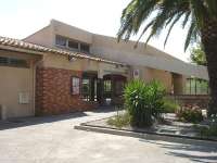 Unlike other stations on the coast line to Spain from Perpignan, which are old traditional buildings, Argeles Sur Mer is a recent build of modern open plan design, as seen in this view along the frontage in August 2015.<br><br>[David Pesterfield 05/08/2015]