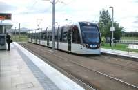 A tram bound for Edinburgh airport pulls into Edinburgh Park Central on 25 August 2015. <br><br>[David Panton 25/08/2015]