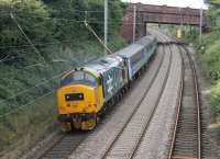 Recently returned to service with DRS, 37401 <I>Mary Queen of Scots</I> has retained its large logo livery and made a fine sight on 27th August 2015 propelling the 0515 Carlisle to Preston service through Hest Bank.<br><br>[Mark Bartlett 27/08/2015]