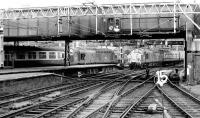 A trio of class 37s at Liverpool Street in September 1980. 37064 is about to depart with a service to Kings Lynn as 37012 arrives with a train from Lowestoft. In the centre background an unidentified member of the class is awaiting the clear to run back to Stratford MPD.   <br><br>[John Furnevel 15/09/1980]