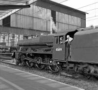 Jubilee No. 45699 <I>Galatea</I> has been halted on the centre road at Carlisle while running tender first out to Upperby after arrival with the Dalesman charter on 25 August 2015. The crew members are obviously not expecting the signal to change any time soon as their attention has been attracted by something more interesting in the opposite direction!<br><br>[Bill Jamieson 25/08/2015]