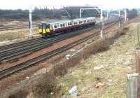 SPT liveried 318258 leaving Carstairs on 17 March 2004 with the morning train to Glasgow Central. As will be observed from the state of the grassy slope the photograph was taken from a layby! <br><br>[John Furnevel 17/03/2004]