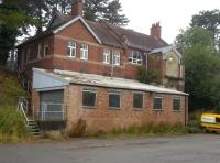 The tyre fitting centre at Brackley [see image 52362] is more recognizable as a former station from track level - despite the brick structure built on the down platform. Notice the abbreviated footbridge, top right.<br><br>[Ken Strachan 14/08/2015]