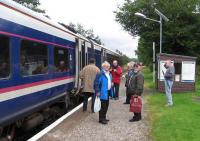 Hard to believe this is the same viewpoint as the shot taken 41 years ago [see image 29053]. A 'Friends of the Far North Line' outing is about to escape the Altnabreac midges by jumping on the 13.55 departure for Thurso and Wick on 26th August 2015. In the left foreground is former Invergordon signalman Iain Macdonald (50 years’ service on the railway), on the far right is Mike Lunan (formerly Chair of the Rail Passengers Committee Scotland), while the man in the red anorak is leading Highland rail activist Richard Ardern.<br><br>[David Spaven 26/08/2015]