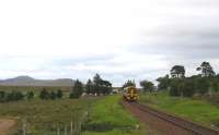 Mountain, moorland and big skies on 27th August 2015, as the 14.00 Inverness-Thurso/Wick coasts into Kinbrace.<br><br>[David Spaven 27/08/2015]