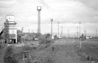 A 1-1-0 heads north through the former Down Yard at Millerhill on 5 June 1987.  On the left is the loading hopper at Monktonhall Colliery.<br><br>[Bill Roberton 05/06/1987]