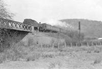 A Rutherglen - Balloch train on the L&D route crossing the NB line at Dumbuck on 12 April 1958. The locomotive is Dawsholm shed's Stanier 3P 2-6-2T no 40186, recently returned from St Margarets following an extended 'loan' [see image 37195]. <br><br>[G H Robin collection by courtesy of the Mitchell Library, Glasgow 12/04/1958]