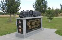 Among the several hundred memorials at the National Memorial Arboretum near Alrewas is this one, dedicated to the Railway Industry. At one end are crests of the GWR, LNER and British Railways. At the other are those of the LMS, SR and British Rail and a rather fine sculpture of a Stanier 8F 2-8-0 stands on top of the plinth.  <br><br>[Mark Bartlett 28/08/2015]