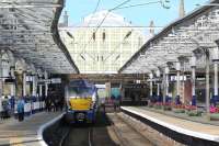 Passengers disembark at Helensburgh Central from 334036 which has just arrived on the 07:48 working from Edinburgh Waverley on 5 September. 334001 is just visible on the right, stabled in Platform 3. <br><br>[Malcolm Chattwood 05/09/2015]