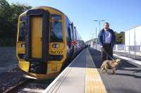 Platform scene at Tweedbank station looking north on the first day...   Sunday 6 September 2015. The gentleman on the right with Border Terrier Guthrie is Bruce McCartney. For a related picture one human generation and four doggy generations earlier [see image 50269].<br><br>[Bruce McCartney Collection 06/09/2015]