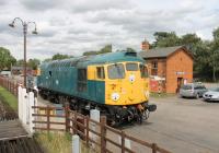 BRC&W Type 2 stabled in a siding alongside the running line at Quorn and Woodhouse station on the Great Central Railway. The rather anonymous 26007 was in fact the class prototype, formerly numbered D5300. The loco is normally based at Barrow Hill but was at the GCR for the autumn diesel gala.<br><br>[Mark Bartlett 29/08/2015]