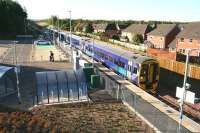 The ScotRail 0845 ex-Tweedbank draws up at the platform at Newtongrange on 6 September 2015 on the first day of scheduled passenger services over the Borders Railway. [See image 52489]<br><br>[John Furnevel 06/09/2015]