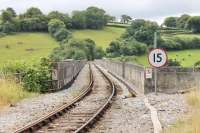 Looking across Calstock Viaduct from the boarded crossing at the end of the station platform. There is a 15mph restriction on the bridge itself and sharp curves on both approaches [See image 52191]. Until 1934 a siding ran out from this point along the right hand side of the viaduct to a wagon lift that allowed wagons to be lowered to and lifted from the Tamar quayside. <br><br>[Mark Bartlett 29/07/2015]