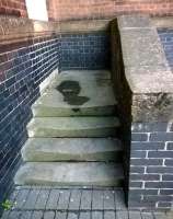 Perhaps they bricked up the door because the steps were worn out? These steps are located to the right of Nuneaton's main station entrance, below the clock tower. [See image 35705]<br><br>[Ken Strachan 01/09/2015]