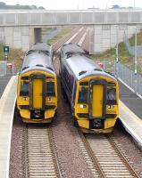 158733 and 158732 pass at Shawfair on 8 September.<br><br>[Bill Roberton 08/09/2015]