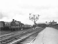 Ex-Caledonian 0-6-0 57569 trundles through Kilmarnock with a down freight on 6 May 1954.<br><br>[G H Robin collection by courtesy of the Mitchell Library, Glasgow 06/05/1954]