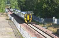 Having cleared Glenesk Viaduct between Shawfair and Eskbank on 10 September, the 1024 Edinburgh Waverley - Tweedbank has just passed the site of the former junction for the Dalkeith branch. [See image 30685] <br><br>[John Furnevel 10/09/2015]