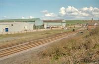 View east at Crag Hall in 2001. The nearer two tracks are a loop on the line east to Carlin Howe and the further away tracks a loop from the sidings to Skinningrove Steel Works seen beyond the railway.<br><br>[Ewan Crawford //2001]