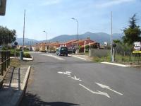 An automatic level crossing, located just east of the still used small freight yard, runs across the minor road Route de Vives in the centre of St-Jean-Pla-de-Corts village. The yard western head shunt is now the limit of the non electrified operational section of the line, continuing west from Le Boulou west yard electrified head shunt, that is still extant through to Ceret Station. <br><br>[David Pesterfield 05/08/2015]