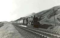 Jubilee 45697 <I>Achilles</I> approaching Ardrossan on 24 May 1960 with a Largs to Penrith excursion train. [Ref query 10055]<br><br>[G H Robin collection by courtesy of the Mitchell Library, Glasgow 24/05/1960]