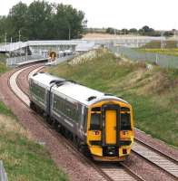 The southern approach to Shawfair on 23 September, with the 0959 Tweedbank - Edinburgh approaching the station. Standing at the southbound platform about to depart is the 1024 Edinburgh - Tweedbank.<br><br>[John Furnevel 23/09/2015]