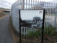 The zig-zag path from the station to National Mining Museum is dotted with information boards about the history of mining in the area. This one though celebrates the predecessor to the shiny new station. It once had standard canopied buildings on both platforms, but lost them some time before that became fashionable, remaining staffed as a halt in all but name. [See image 24342]<br><br>[David Panton 22/09/2015]