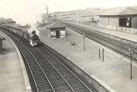 Ardrossan shed's ex-Caledonian 'Jumbo' 0-6-0 no 57274 struggles up the line from Irvine and on through Crosshouse station on 6 May 1953 with a coal train heading for Kilmarnock.<br><br>[G H Robin collection by courtesy of the Mitchell Library, Glasgow 06/05/1953]