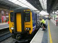 Loading a bicycle onto a service to Manchester Airport at Preston.<br><br>[Veronica Clibbery 17/09/2015]