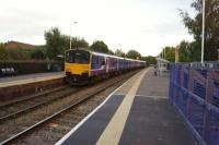 A Northern service to Bolton departs from Darwen on 26 September 2015. Recent changes around here have seen the extension of the passing loop on both sides of the station and the provision of additional signals. The northern end of the loop is now at the site of the former Hoddlesden Jct.<br><br>[John McIntyre 26/09/2015]