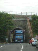 It is often said that the road loading gauge benefits road hauliers over rail but this is not the case a short distance south of Port Vendres, on the road to Banyuls sur Mer, as signified by the tight clearance for the standard height road tractor and trailer unit seen heading south through the single track underbridge below the SNCF coast line from Perpignan to Cerbere; which then crosses the border to Portbou in Spain, and continues to Barcelona under Renfe. <br><br>[David Pesterfield 07/08/2015]