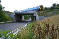 Looking south along a remarkably quiet A7 on 25 September 2015. The 1228 ex-Tweedbank 4-Car 158 combination is heading for its next scheduled stop at Newtongrange en route to Edinburgh Waverley.<br><br>[John Furnevel 25/09/2015]