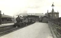 Class 2P 4-4-0 40571 prepares to leave Kilmarnock on 6 May 1954 with a train for St Enoch via Dalry.<br><br>[G H Robin collection by courtesy of the Mitchell Library, Glasgow 06/05/1954]