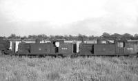 A pair of McIntosh ex-Caledonian 0-4-4 tanks stored in the sidings at Lugton awaiting disposal on 26 June 1962. 55266 and 55206 had been officially withdrawn from Corkerhill shed 9 months earlier. Both were cut up at Connels of Coatbridge in September 1963.<br><br>[John Robin 26/06/1962]