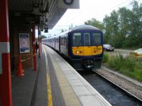 Northern 319365 waits in Platform 5 at Wigan North Western. These 4-car EMUs have replaced Sprinters and Pacers on the newly electrified line to Lime St via St. Helens. <br><br>[Veronica Clibbery 17/09/2015]