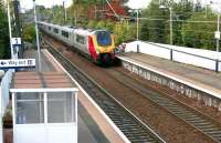 A Virgin Voyager runs east through Slateford on 4 October 2015 as the 0850 Polmadie TMD - Edinburgh Waverley ECS working. The stock will form the Sunday morning 1051 Edinburgh Waverley - London Euston (via Carlisle and the WCML). The train has just passed the crossover which allows eastbound trains access to Slateford Junction [see image 4785].<br><br>[John Furnevel 04/10/2015]