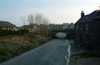 View south down Carseview Road in Forfar during 1996. The Strathmore line crossed the road with a large bridge which also bore the west end of Forfar station. The bulk of the station was off to the left. Since the photograph was taken the cobbles and bridge have gone. The building on the right is often visible in photographs taken at the station looking to Perth.<br><br>[Ewan Crawford //1996]