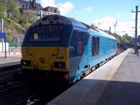 Caledonian Sleeper engine 67003 stabled at the eastern end of the station. The gable end of the station roof canopy is reflected on the windscreen.<br><br>[Andrew Wilson 24/09/2015]