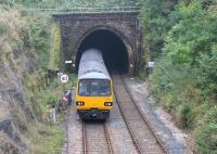 Northern 144016, on the daily Heysham Port to Leeds service, enters the 1230yd Melling Tunnel on 3rd October 2015. Melling station, a short distance behind the train, closed in 1952 but just beyond the tunnel the service will call at Wennington. [Ref query 47381]<br><br>[Mark Bartlett 03/10/2015]