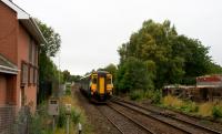 The 1037 Oban departure from Glasgow Queen Street passes Maryhill Park Junction on 23rd September 2015. On the left of the picture is the building which was intended to replace the original signalbox.<br><br>[Colin McDonald 23/09/2015]