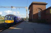 A Liverpool to Manchester Victoria service arrives at Edge Hill station on 09 October 2015. To the right of the station building is the eastbound line and a second island platform used by the services from the south.<br><br>[John McIntyre 09/10/2015]