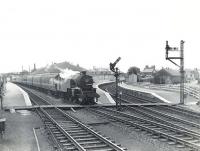 A Saturday Girvan - St Enoch train calls at Kilwinning on 4 July 1959. Locomotive in charge is Corkerhill shed's Fairburn 2-6-4T no 42247. <br><br>[G H Robin collection by courtesy of the Mitchell Library, Glasgow 04/07/1959]