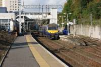 320311 departs from Dalmuir with an eastbound service via Yoker on 08 October 2015.<br><br>[John McIntyre 09/10/2015]