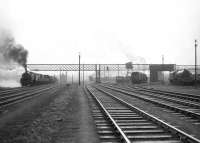 Edge Hill based <I>Crab</I> 2-6-0 42920 brings a southbound freight past Upperby shed on 17 June 1964. Standing alone on the far right awaiting disposal is Stanier Pacific 46200 <I>The Princess Royal</I> [see image 52671]. <br><br>[John Robin 17/06/1964]