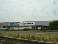 View from the adjacent A10 autoroute from the south of the DB Schenker Joyau road delivery hub at Massy south of Paris, sited near the west end of Orly Airport runway, whilst halted by heavy Sunday afternoon traffic  <br><br>[David Pesterfield 09/08/2015]