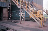 37326 'Glengarnock' draws forward (along with an unseen 37312 'Clyde Iron') slowly under the loading bunker at Hunterston high level in 1987. The train will be loaded with ore bound for Ravenscraig.<br><br>[Ewan Crawford //1987]