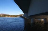 View under the new concrete bridge which carries the Cambrian Coast line across the Afon Dwyryd. While the replacement does not have the character of the original timber trestle bridge [see image 50842], it does have a distinctive style, even if it is reminiscent of Wallace and Gromit's 'Wrong Trousers'.<br><br>[Colin McDonald //]