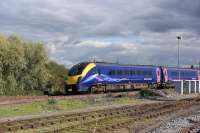 A FGW (Now GWR) service formed by <I>Adelante</I> 180102 passes Didcot heading for Oxford and the Cotswolds line to Worcester with a service from Paddington on 081015.<br><br>[Peter Todd 08/10/2015]